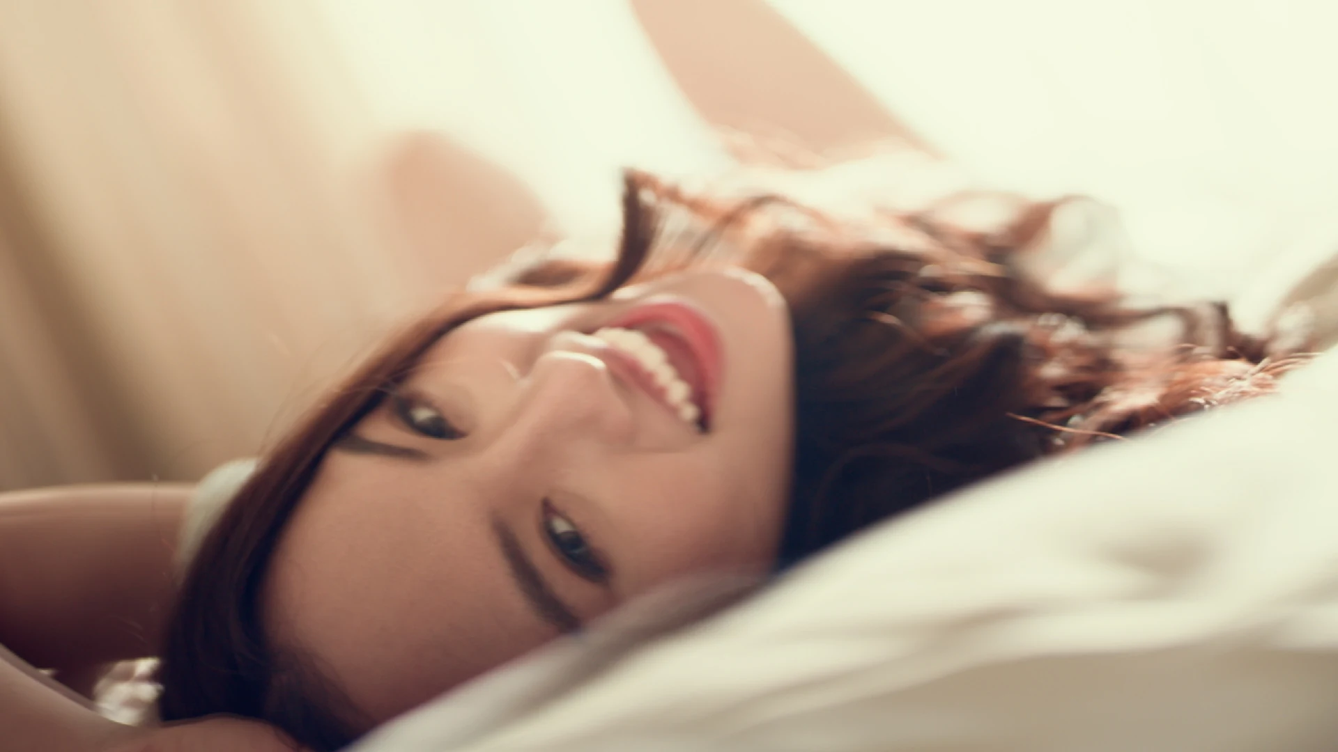Chattaraa smiling in a softly sunlit portrait